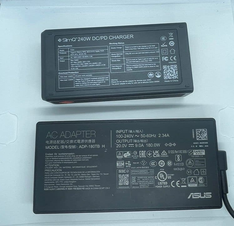 Size comparison — SlimQ charger next to ASUS ROG Zephyrus G15 laptop