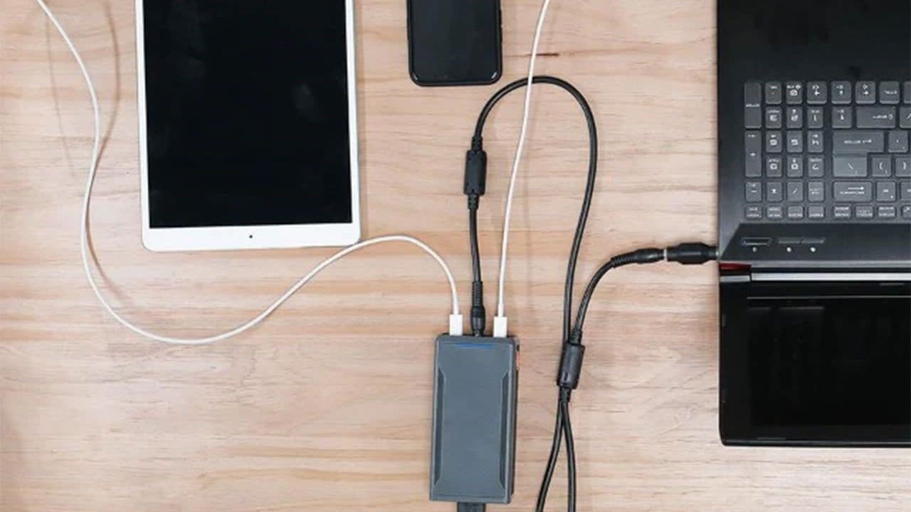 SlimQ 240W SuperCharger powering a laptop plus two USB-C devices simultaneously