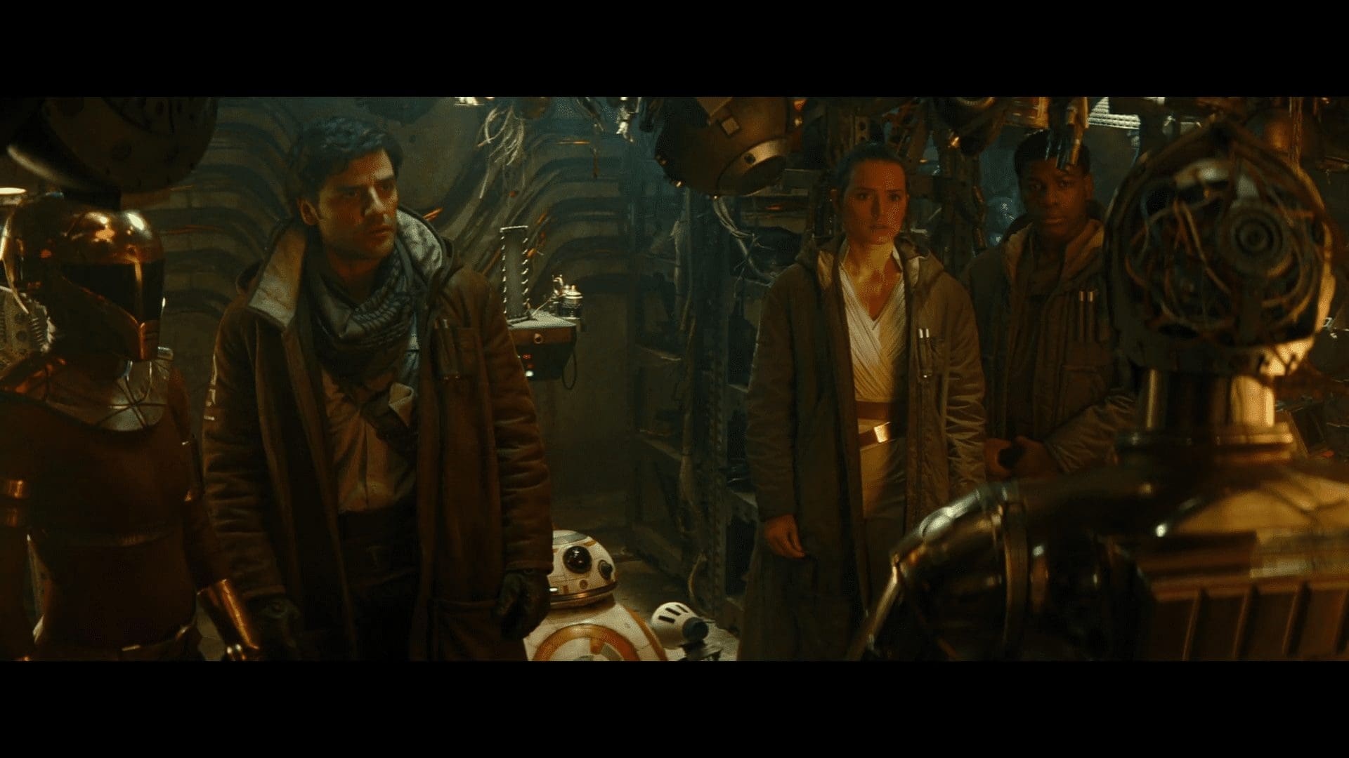 C-3PO turns to his friends in the droid workshop